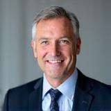 Professional headshot of CEO John Doe