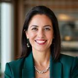 Professional headshot of CFO Maria Garcia