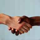 Two hands shaking, symbolizing integrity and trust